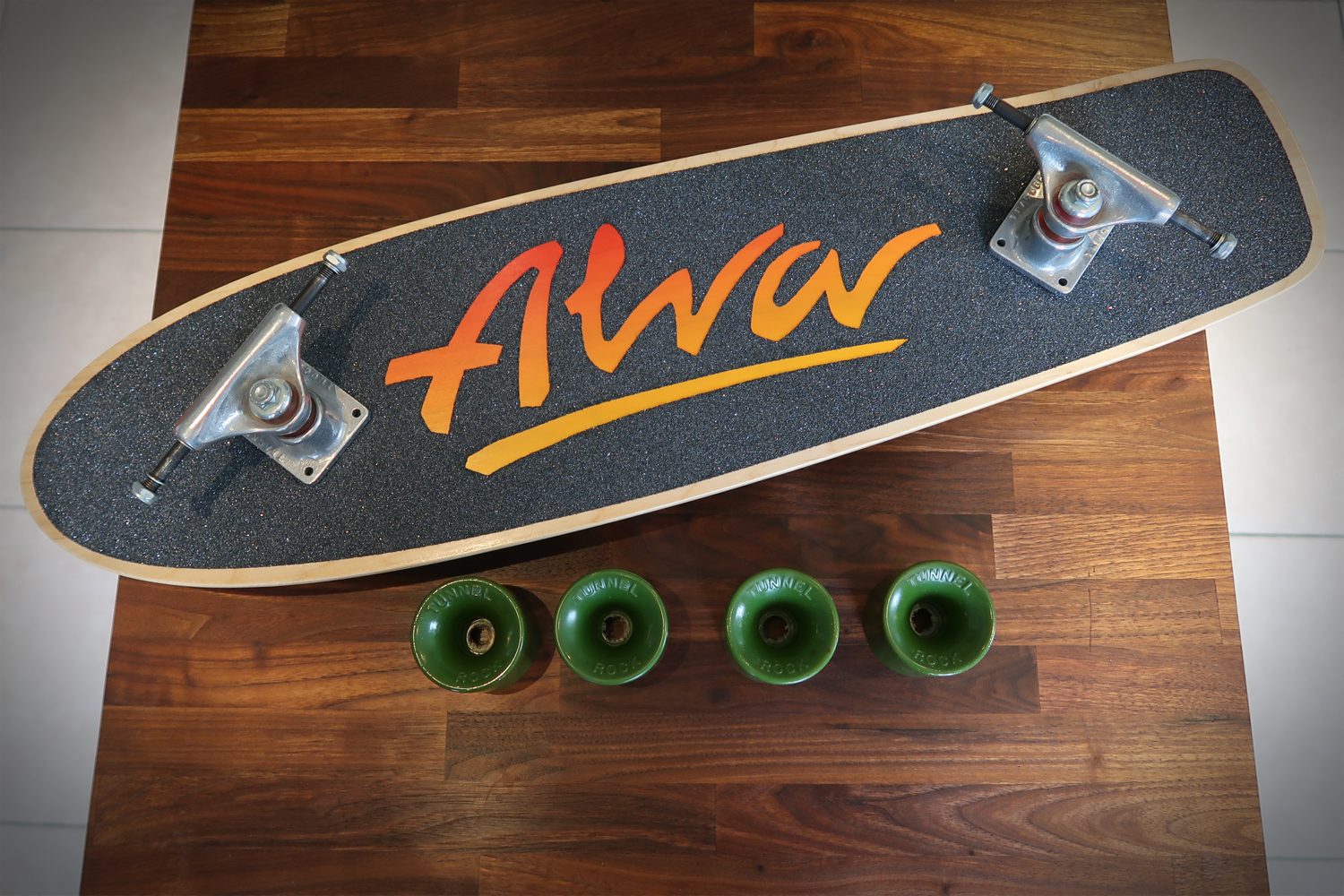 Alva 77 deck, Tracker Mid Tracks and Tunnell Rock wheels.