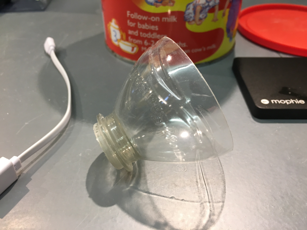 Water bottle nozzle cut from the bottle to shield the Raspberry Pi lens from rain