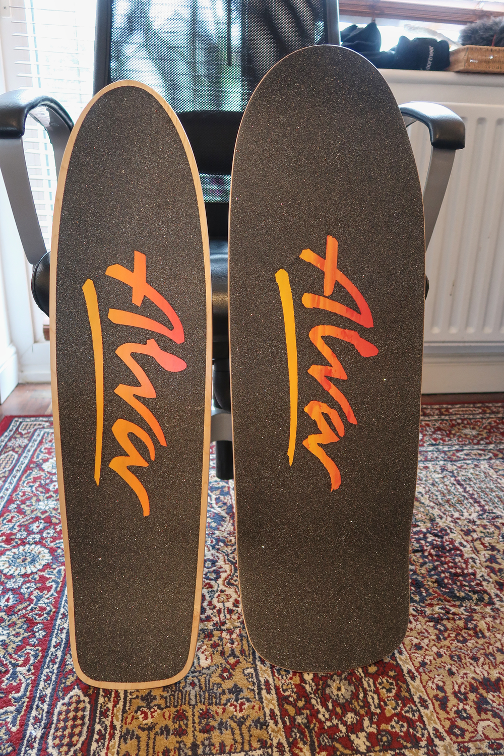 Two Alva skateboard decks
