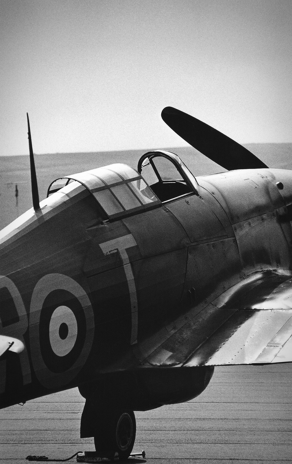 Black and white photo of a Hawker Hurricane at Duxford